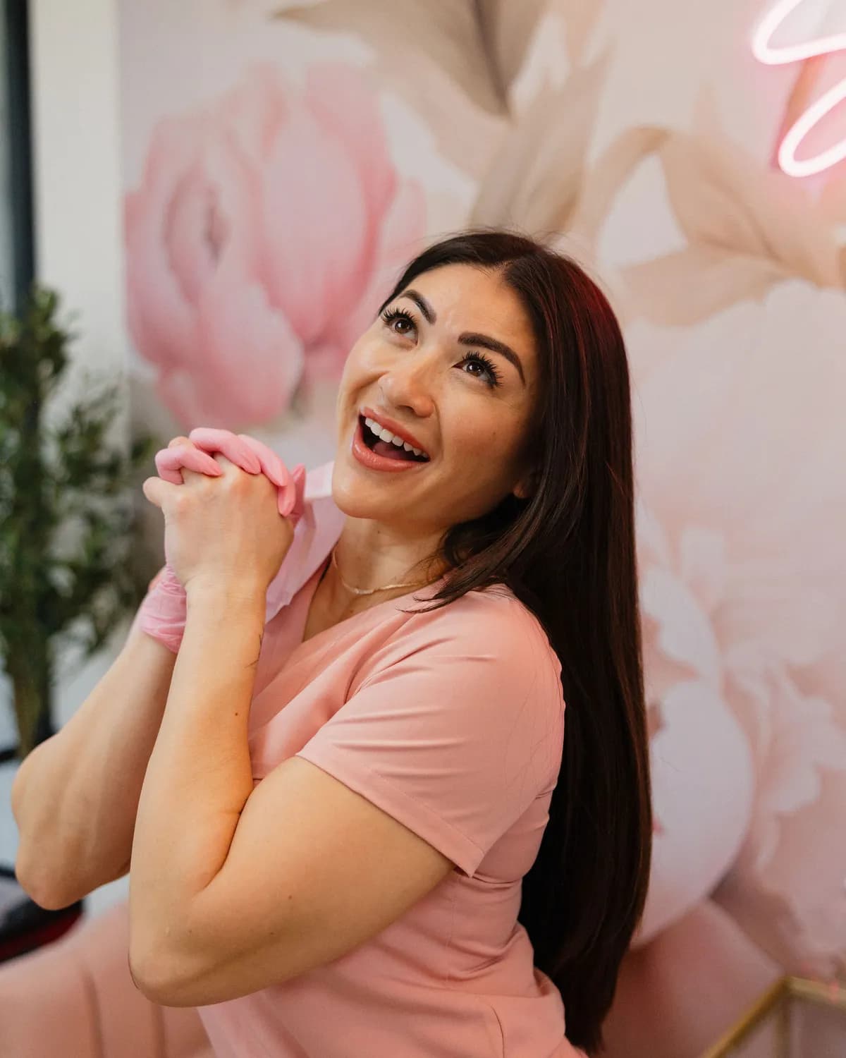Leslie laughing in the Pink Diamond Laser lobby