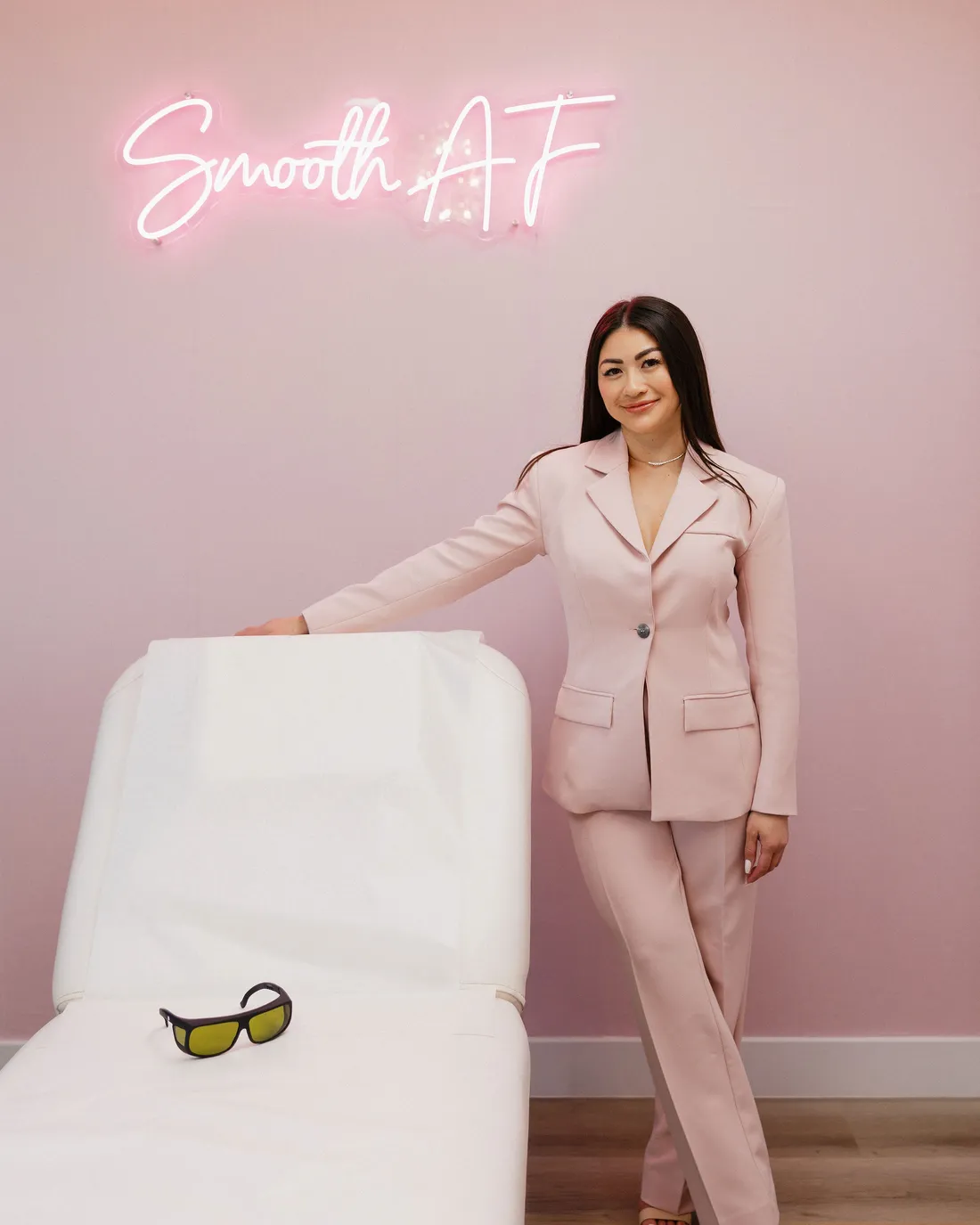 Leslie Nguyen, RN, beside the treatment bed at Pink Diamond Laser